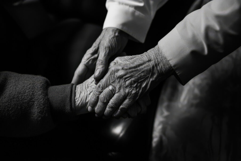 Senior and caregiver smiling together in a well-kept home in Aberdeen, NC, showing independent living support.
